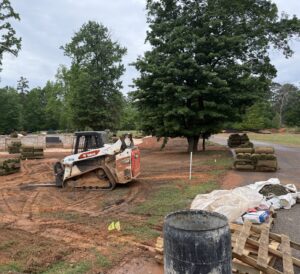 Track loader moving pallets of sod on a commercial job
